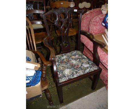An older reproduction Chippendale style Mahogany open armed Elbow Chair having fretworked splat, splayed arms and drop-in fab