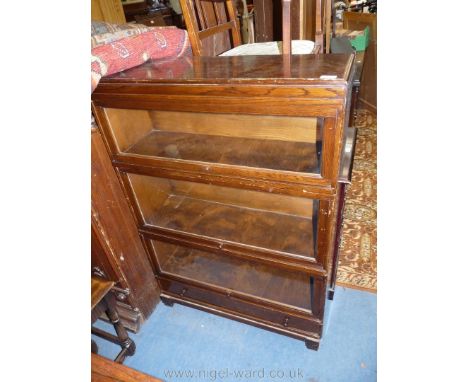 An Oak Globe Wernicke style three stage Bookcase with drawer to base, 33 3/4" wide x 48 1/2" high.