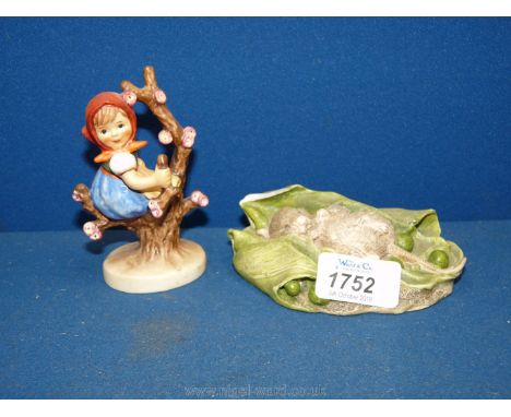 A Goebel figure of a girl on apple tree and a Beswick figure of sleeping mouse