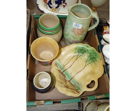 A quantity of Radford art deco pottery including three vases, large jug and tree decorated platter.