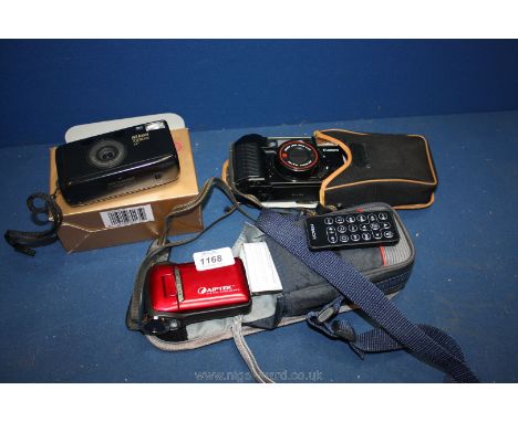 A cased Canon Camera with an auto focus lens 38mm 1.2.8, Nikon zoom 300 a/f camera boxed, a cased Aiptek digital camcorder wi