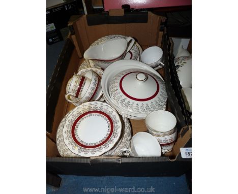 A Roslyn china part Tea and Dinner service with red band and gold trim including two lidded tureens, cups, saucers, side plat