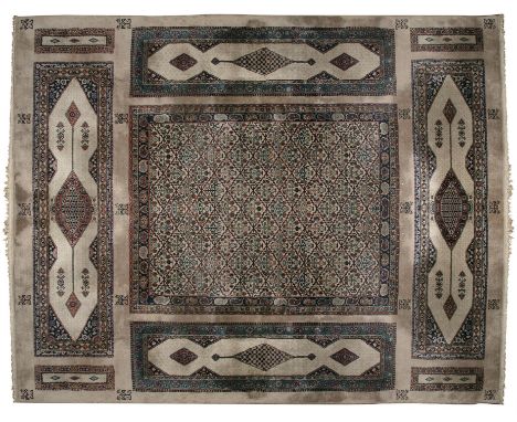 AN UNUSUAL CAUCASIAN COMBINATION DESIGN CARPET, mid-20th century, woven with a mixed variety of individual rug patterns and c