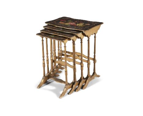 A NEST OF VICTORIAN GILTWOOD QUARTETTO TABLES, of graduated size, with painted tops, on ring turned columns raised on tressel