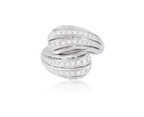 A DIAMOND COCKTAIL RING, obliquely-set with bombé openwork shoulders, pavé-set with brilliant-cut diamonds to a plain hoop, m