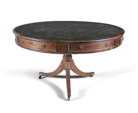 AN IRISH MAHOGANY 19TH CENTURY DRUM TABLE, of circular form, the top inset with tooled leather scriver, above a frieze of six