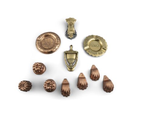 A COLLECTION OF COPPER AND BRASS WARE, comprising seven miniature copper jelly moulds, varying patterns; together with two as