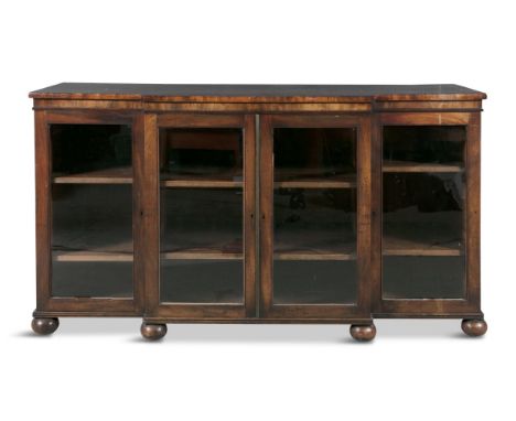 A 19TH CENTURY BREAKFRONT MAHOGANY CABINET, with twin central cupboard glazed door, flanked by two glazed doors, opening to r