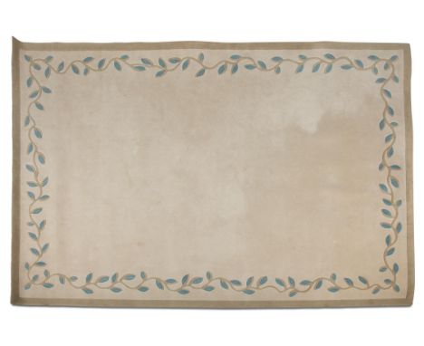A MODERN BEIGE CARPET, the light beige reserve with floral trailing border in blue tones, contained within a plain narrow boa