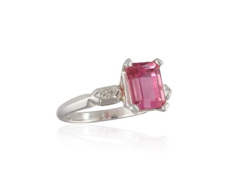 A TOURMALINE AND DIAMOND RING, composed of a rectangular-cut pink tourmaline weighing approximately 2.00cts within a four-cla