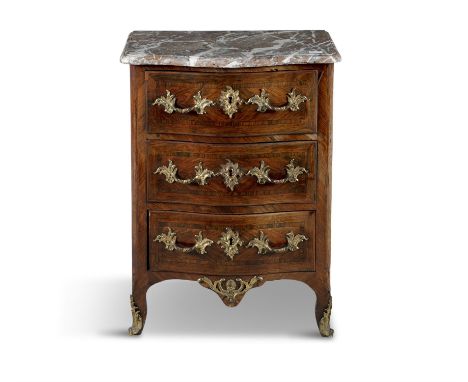 A LOUIS XVI KINGWOOD AND CROSS BANDED COMMODE, with cast ormolu escutcheons in rococo taste, with three drawers on short scro