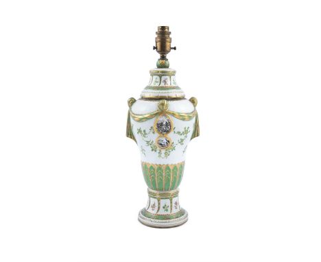 A LATE 18TH/ EARLY 19TH CENTURY PORCELAIN VASE, converted to a table lamp, with green and gilded moulded swag decoration and 