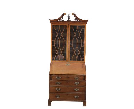 A GEORGE III MAHOGANY SLOPEFRONT BUREAU BOOKCASE, with broken swan neck pediment, above twin astragal glazed panel doors, enc