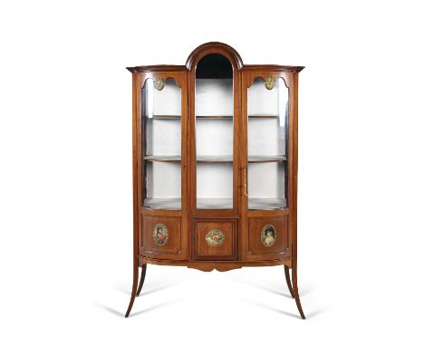 AN EDWARDIAN PAINTED SATINWOOD DISPLAY CABINET, c.1880, of bowfront design, with arched top, above twin glazed panel doors, i