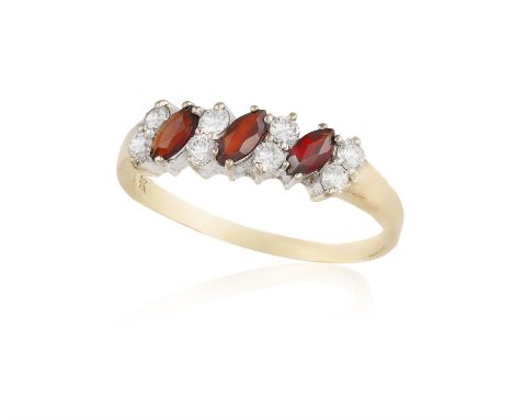 A GARNET AND DIAMOND RING, composed of three marquise-shaped garnets between brilliant-cut diamonds, mounted in 9K gold, ring