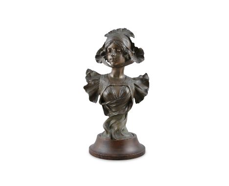 HENRI JACOBS (1864-1935) Portrait bust of a girl in a bonnet  Spelter, on a circular socle base, 52cm high (including base) 