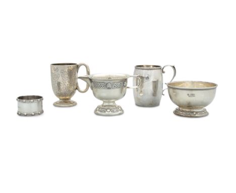 A COLLECTION OF SILVER, comprising: a sugar bowl, cream jug and napkin ring ring with Celtic revival decoration; Irish silver