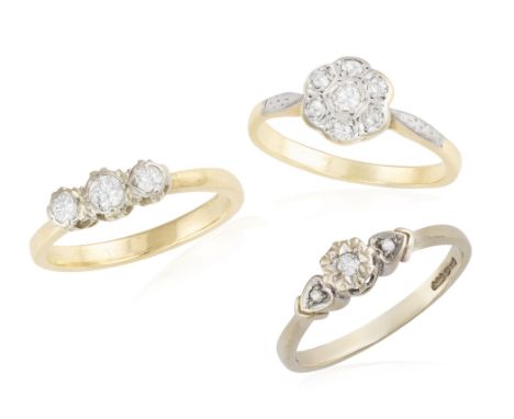 A GROUP OF THREE DIAMOND RINGS, the first ring set with a brilliant-cut diamond within star motif and between two single-cut 