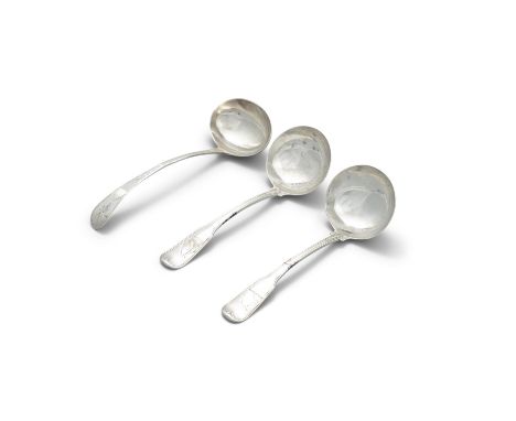 A PAIR OF GEORGE III IRISH SILVER FIDDLE PATTERN SAUCE LADLES, Dublin c.1788, mark of John Power, handle terminals crested, 1