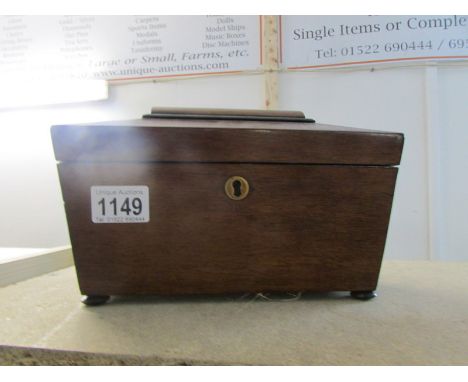 A mahogany tea caddy