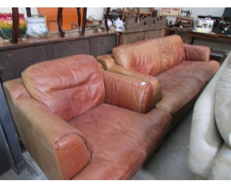 A 3 seat leather sofa and matching chair