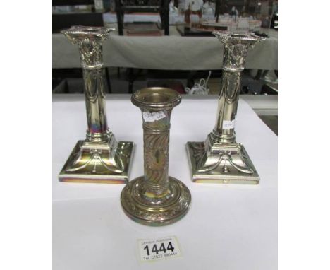 A pair of silver plated Mappin and Webb candlesticks and another candlestick a/f