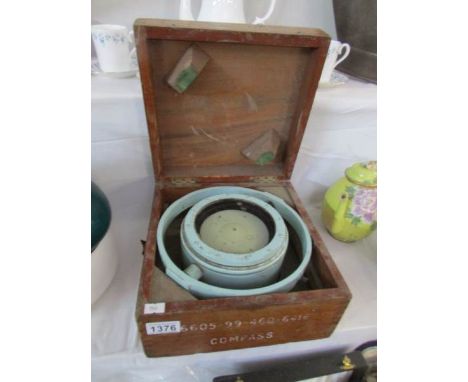 A cased compass