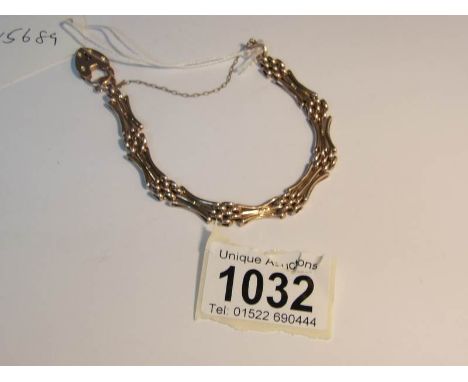 A 9ct rose gold gate bracelet