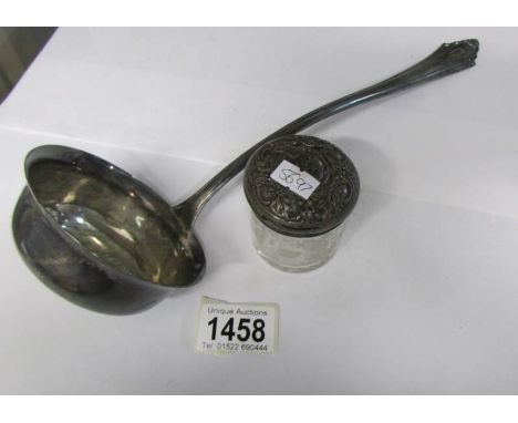 A continental (800) silver ladle and a silver topped jar