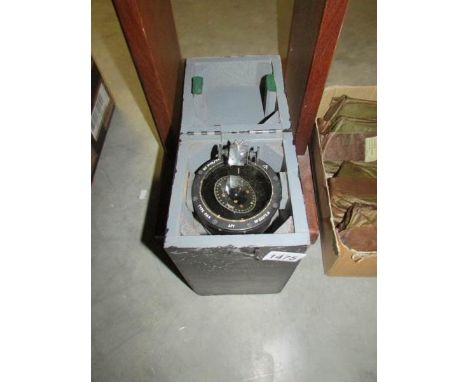 A cased compass