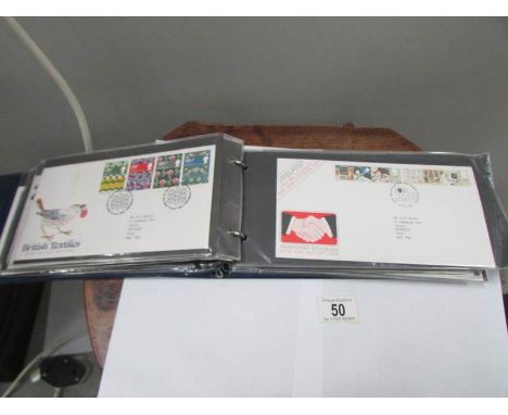 An album of 55 UK first day covers, 1981-84