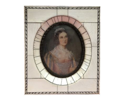 An antique hand painted miniature portrait of a lady
