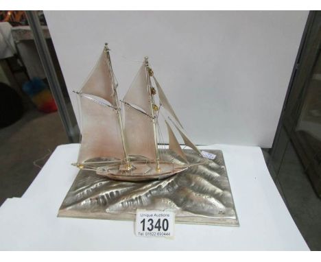 A model sailing ship on base marked 'silver 970'
