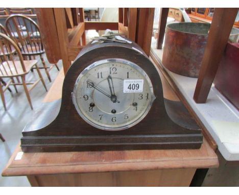 An oak mantel clock