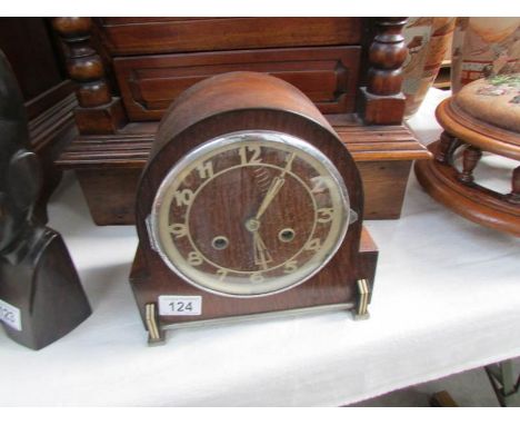An oak mantel clock