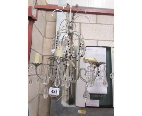 A 6 light glass chandelier