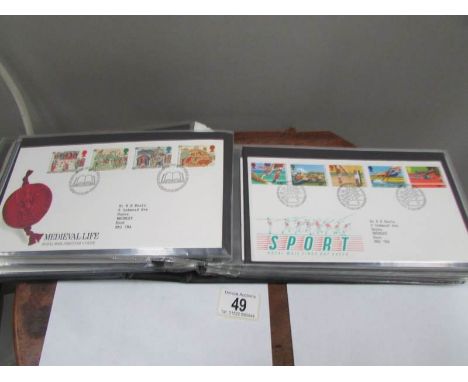 An album of 58 UK first day covers 1984-89