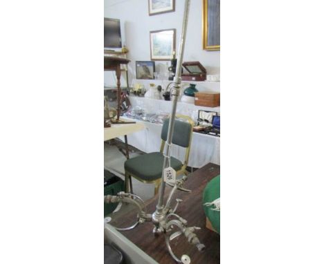 A chrome plated 3 arm gas ceiling light