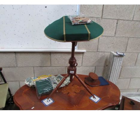 A lace makers cushion on stand, lace bobbins and other accessories