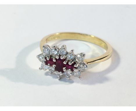 An 18ct yellow gold ruby and diamond ring, size N