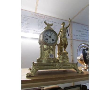 A French gilded mantel clock surmounted figure, in working order