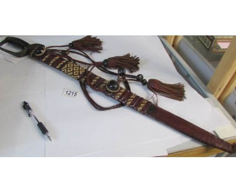 An old sword in decorative scabbard