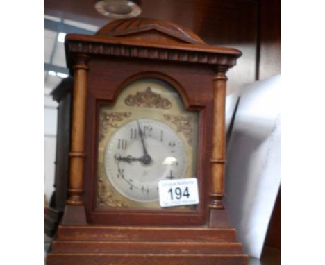 An oak mantel clock