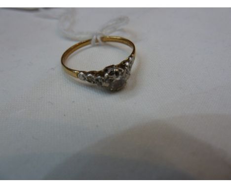 18ct gold solitaire diamond ring set single claw-set stone with small diamonds to the shoulders (worn)