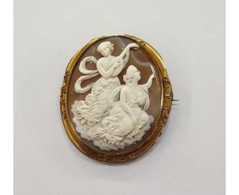 Gold-coloured metal and shell cameo brooch carved with allegorical maidens, one playing lute, scroll decorated border