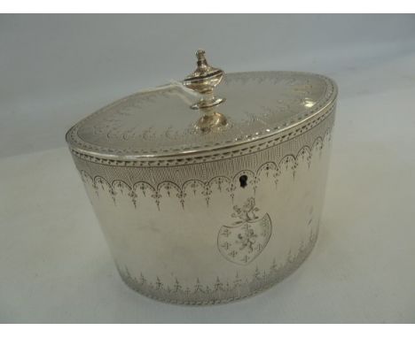 George III silver neoclassical oval tea caddy, with urn shaped finial, garland engraved borders, the hinged cover opening to 
