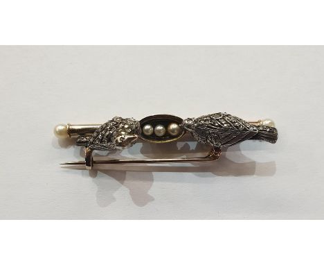 Victorian gold diamond and ruby bar brooch in the form of two doves on perch, each bird set with old cut diamonds and ruby ey