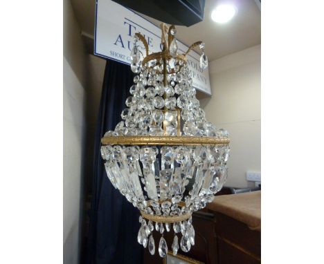 Cut glass and gilt chandelier pattern light fitting, with foliate scrolls, foliate gilt borders suspending graduated cut butt