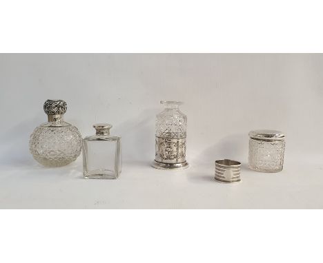 Silver-topped scent bottle with cut glass ovoid body, scrolling foliate lid, a silver engine-turned napkin ring and three fur