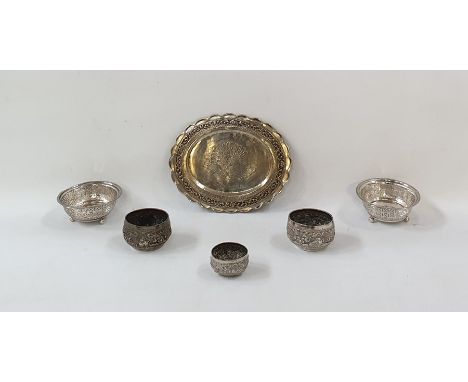 Three Eastern white metal small bowls, animal and scroll decorated, possibly Indian, two foreign white metal pierced trinket 